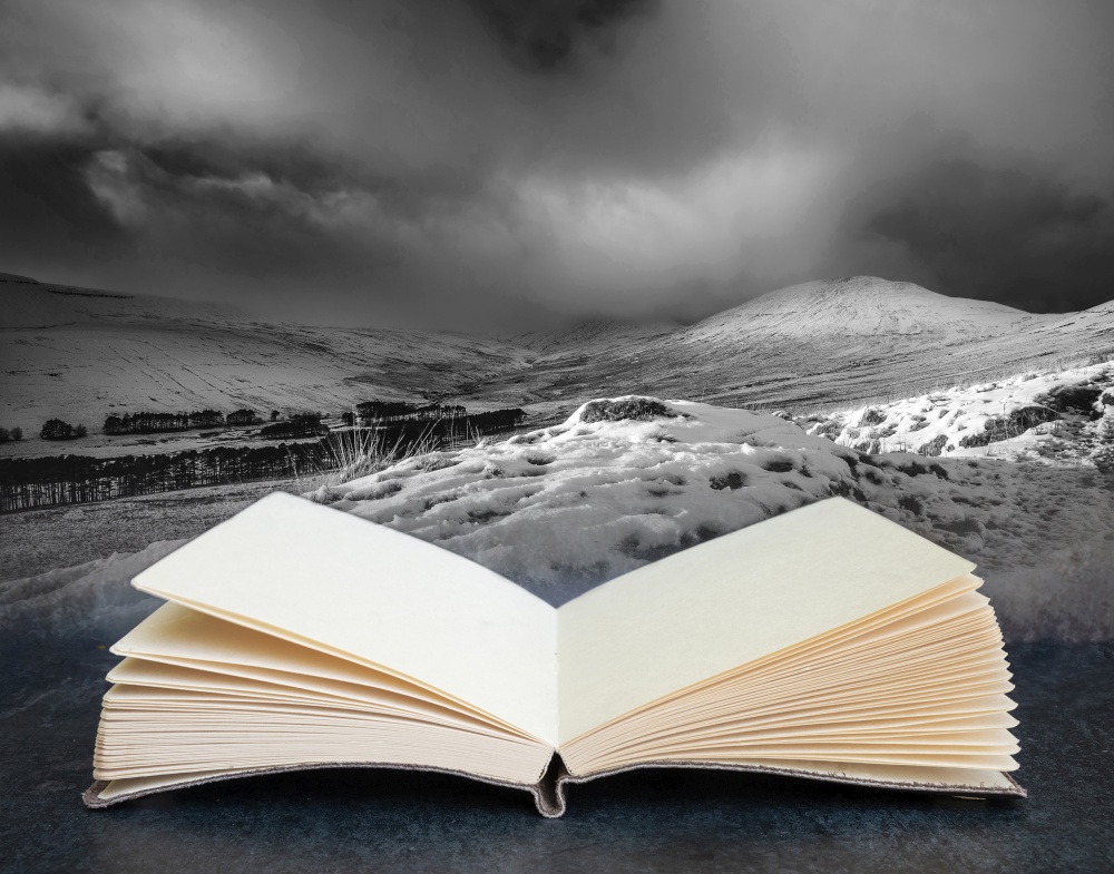 Stunning Winter panorama landscape snow covered countryside with beautiful sky and clouds in pages of book composite image