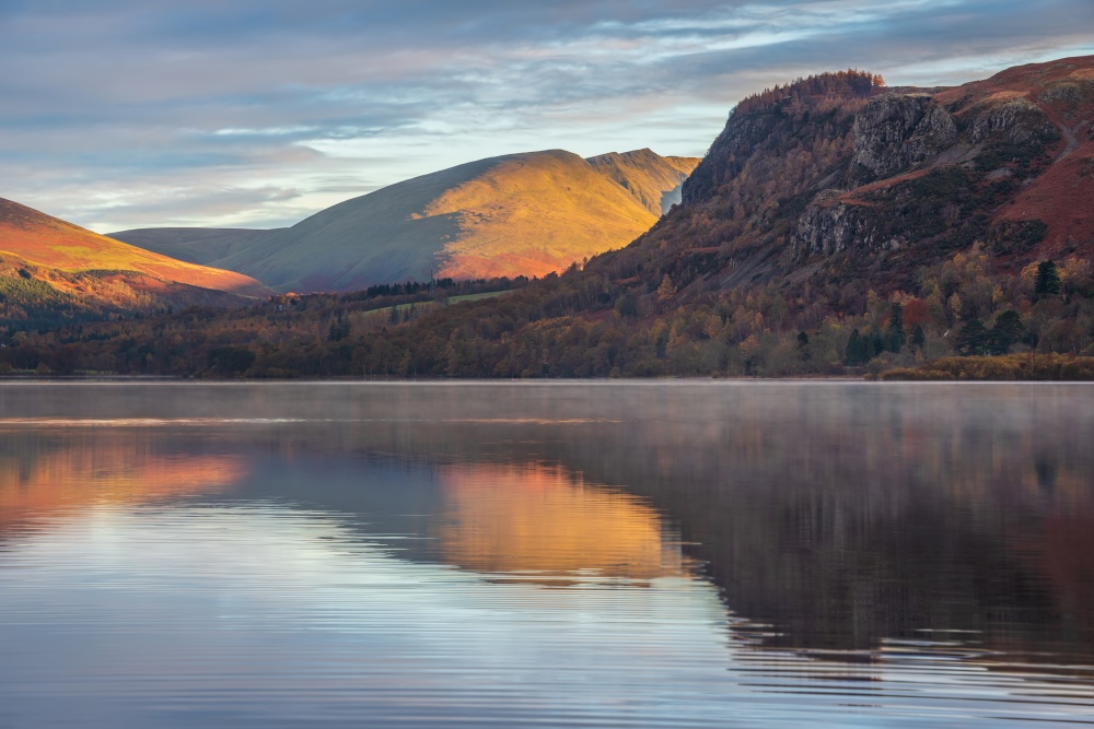 Landscape view across Derwentwater from Manesty Park towards Blencathra and Walla Crag with stunning Autumn colors