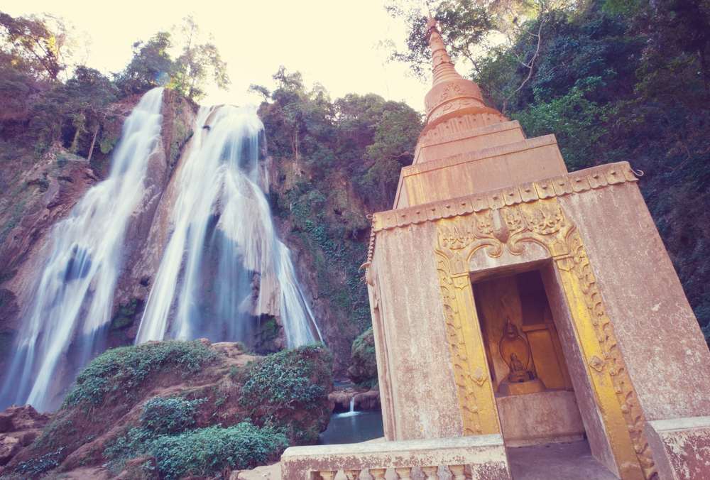 Beautiful waterfall and buddhist stupa in Myanmar