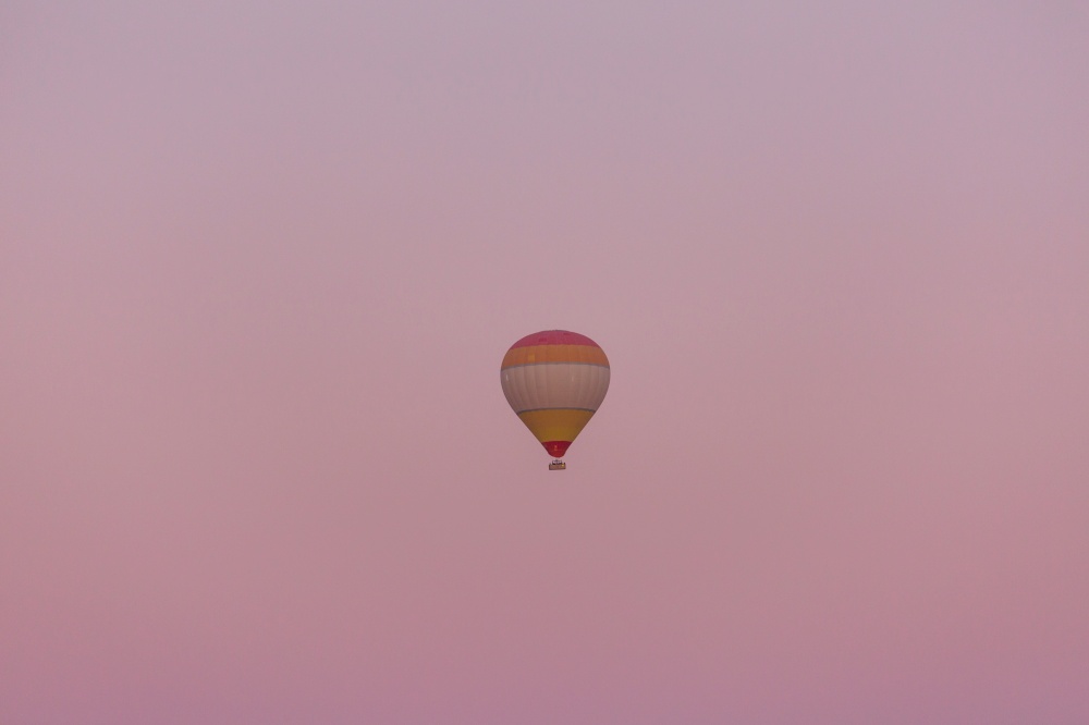 a balloon against the dawning skyline