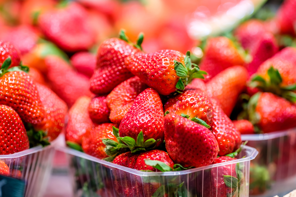 Fresh red strawberries for sale at marketplace