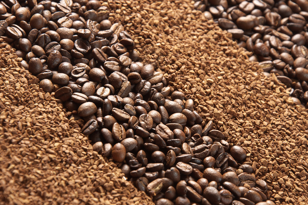 Coffee beans. Coffee granules as background or texture. Coffee beans and coffee granules. Natural and soluble coffee. Background of coffee beans and granules.