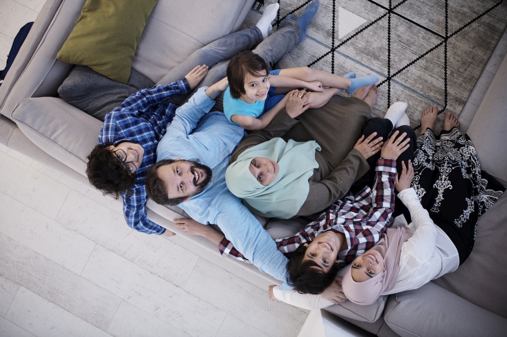 muslim family portrait with arab  teenage kids at modern home interior top view