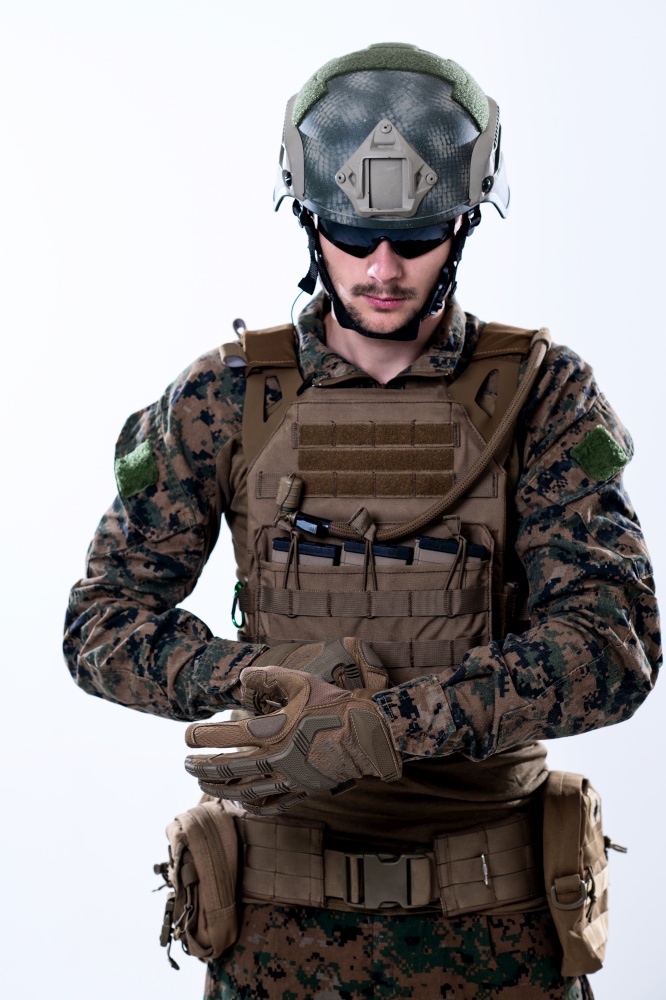 closeup of modern warfare soldier hands putting protective battle gloves white background