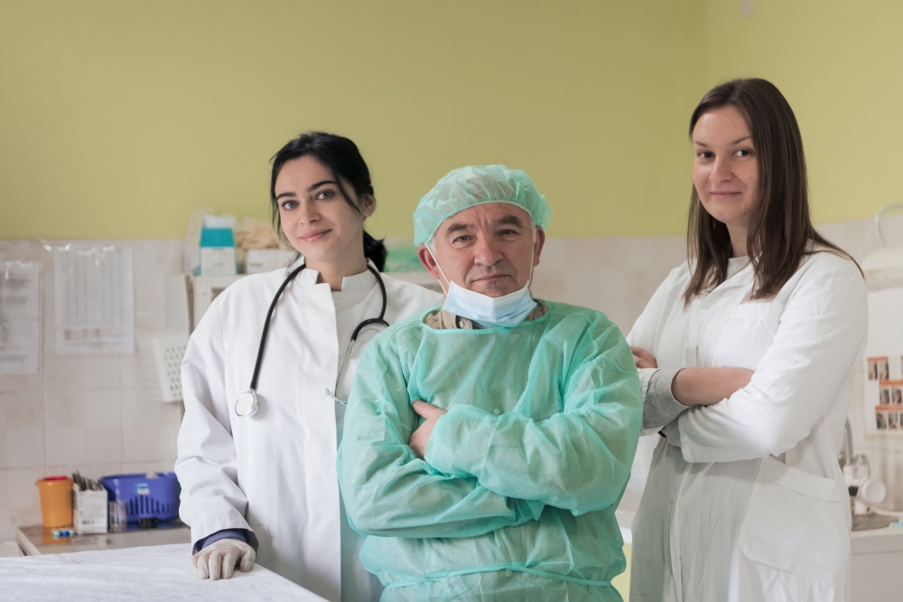 Portrait of doctors wearing uniform and preparing to doing surgical operation at the theater of animal hospital. or veterinary. Medical Concept. High quality photo. Portrait of doctors wearing uniform and preparing to doing surgical operation at the theater of hospital. Medical Concept.