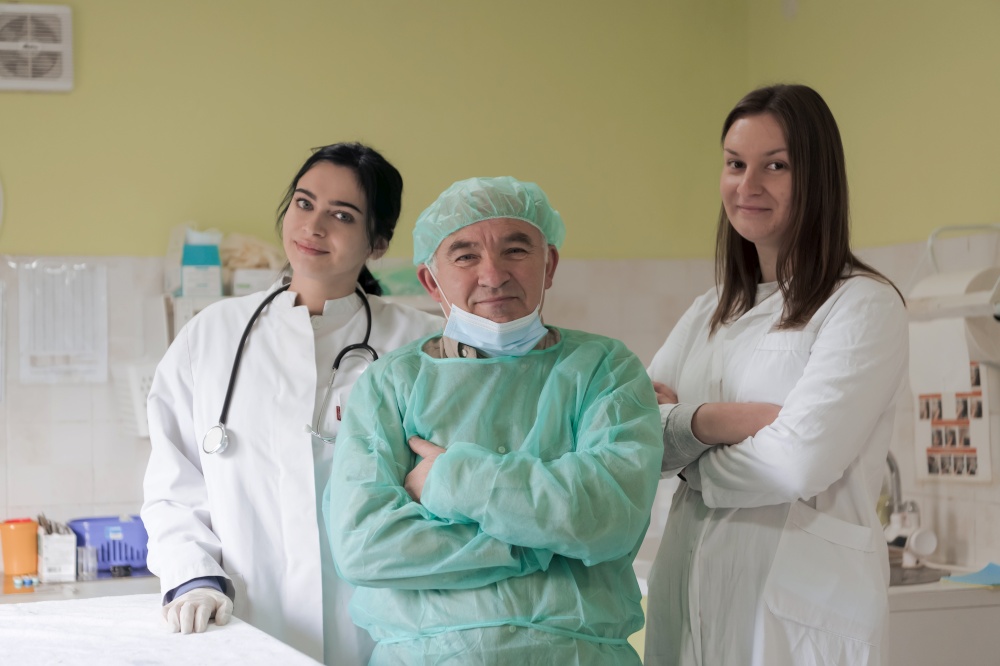 Portrait of doctors wearing uniform and preparing to doing surgical operation at the theater of animal hospital. or veterinary. Medical Concept. High quality photo. Portrait of doctors wearing uniform and preparing to doing surgical operation at the theater of hospital. Medical Concept.