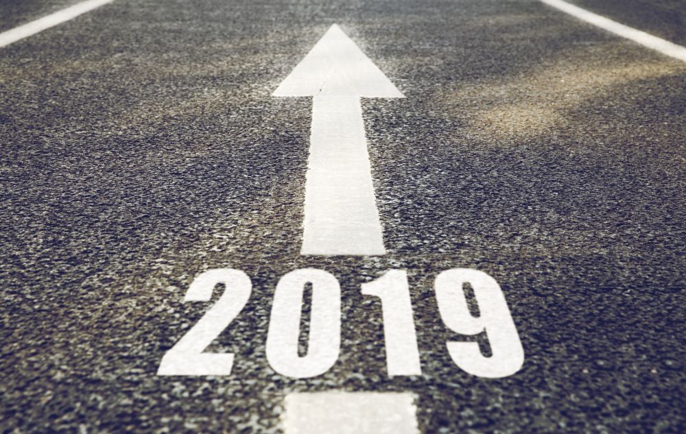 future and destination concept - road marking in form of 2019 year and arrow. road marking in form of 2019 year and arrow