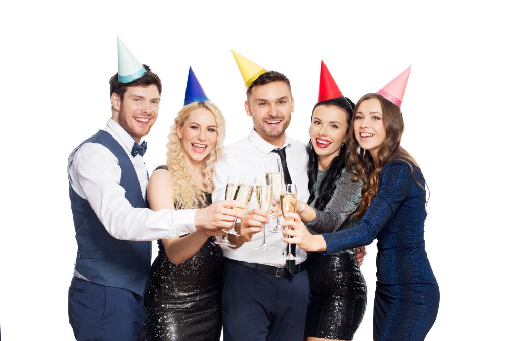 celebration and holidays concept - happy friends clinking champagne glasses at birthday party. friends with champagne glasses at birthday party