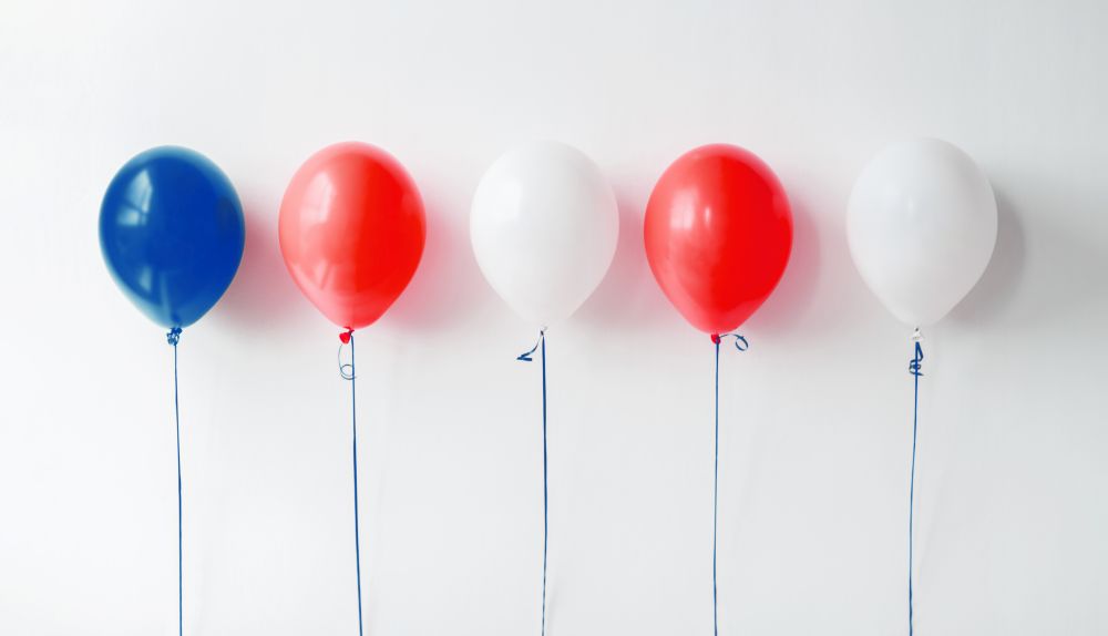 holidays and decorations concept - red, white and blue air balloons for 4th of july or birthday party. party decoration with red, white and blue balloons