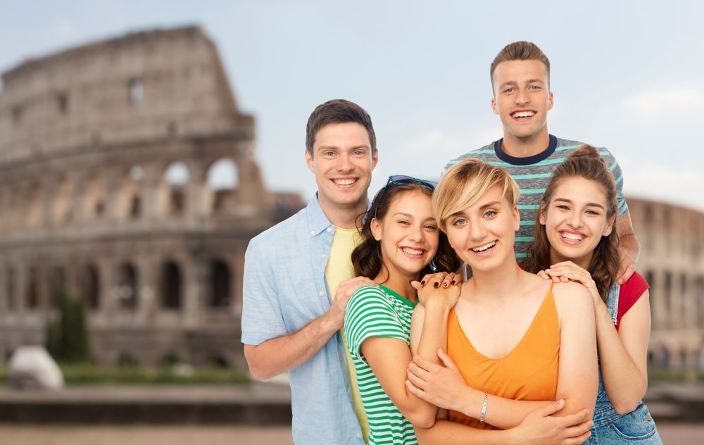 travel, tourism and vacation concept - group of happy smiling friends over coliseum background. happy friends over coliseum background