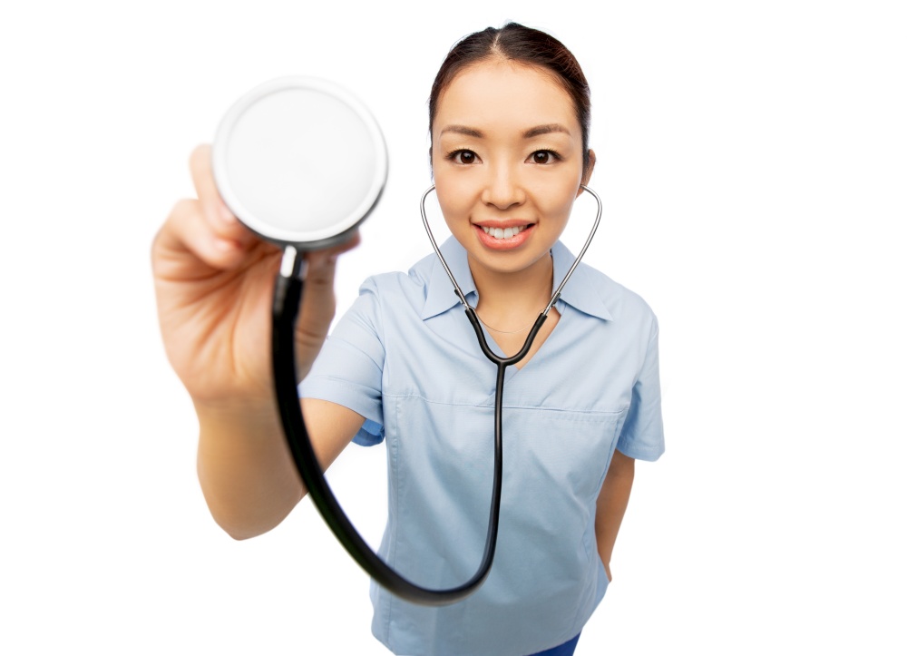 medicine, profession and healthcare concept - portrait of happy smiling asian female doctor or nurse in blue uniform with stethoscope over white background. happy smiling asian female doctor with stethoscope