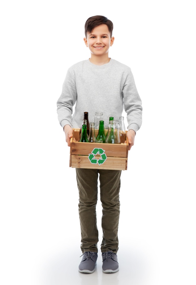recycling, waste sorting and sustainability concept - smiling boy holding wooden box with glass bottles and jars over white background. smiling boy with wooden box sorting glass waste