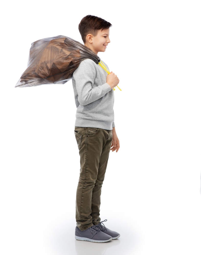 recycling, waste sorting and sustainability concept - smiling boy with paper garbage in plastic bag over white background. smiling boy with paper garbage in plastic bag
