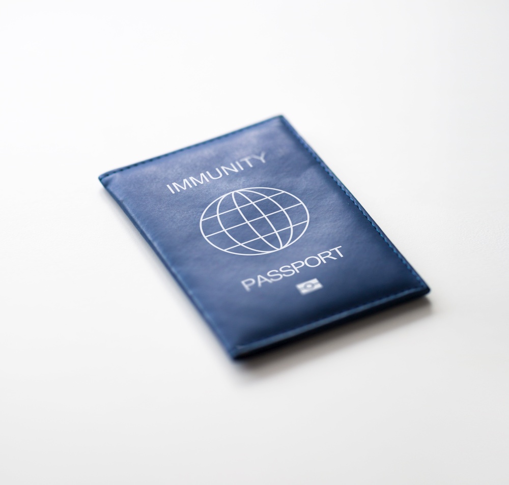tourism, travel and health care concept - immunity passport on white background. immunity passport on white background