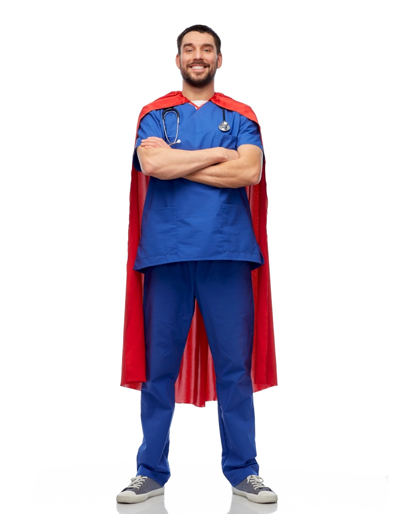 healthcare, profession and medicine concept - happy smiling doctor or male nurse in blue uniform and red superhero cape over white background. smiling doctor or male nurse in superhero cape