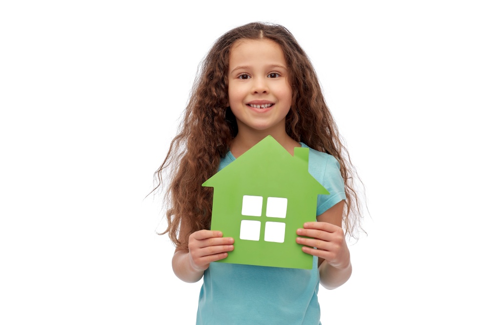 eco living, environment and sustainability concept - smiling little girl holding green house icon over white background. smiling little girl holding green house icon