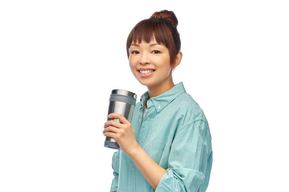 sustainability and people concept - portrait of happy smiling young asian woman in turquoise shirt with thermo cup or tumbler for hot drinks over white background. woman with thermo cup or tumbler for hot drinks