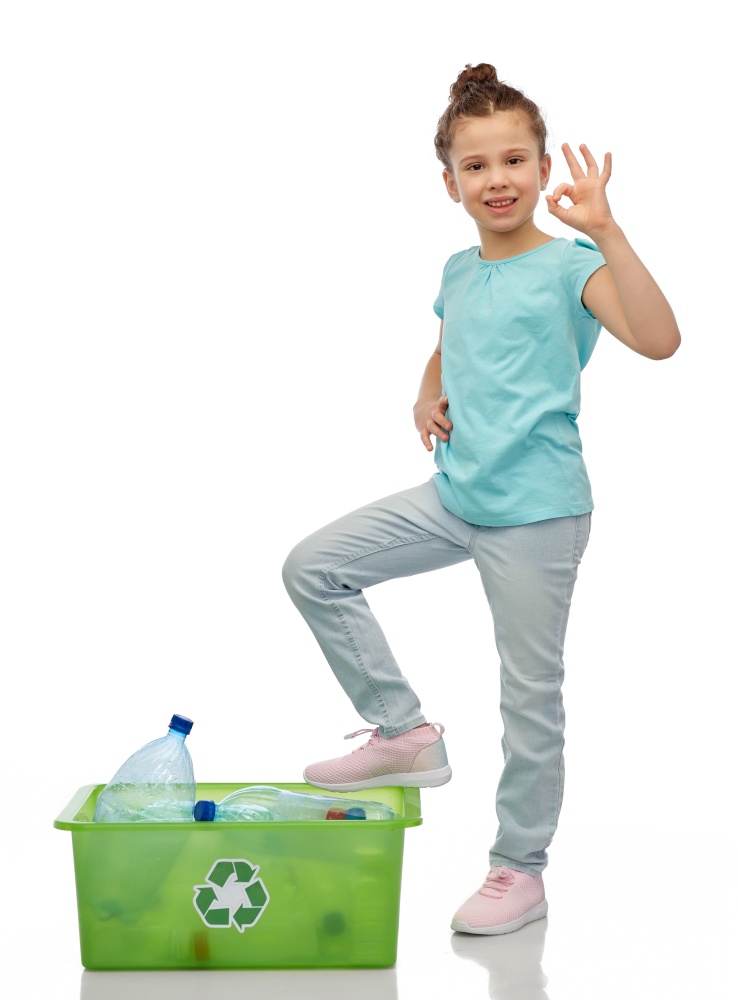 recycling, waste sorting and sustainability concept - smiling girl with plastic bottles in box showing ok hand sign over white background. smiling girl sorting plastic waste showing ok sign