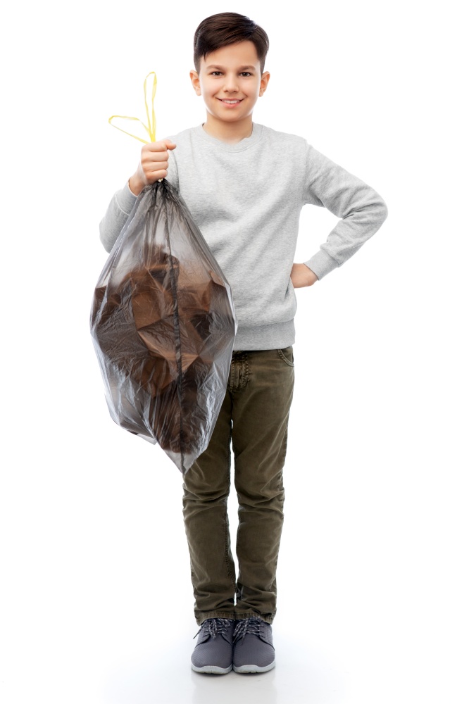 recycling, waste sorting and sustainability concept - smiling boy with paper garbage in plastic bag over white background. smiling boy with paper garbage in plastic bag