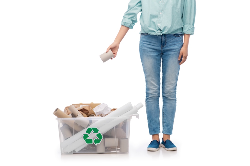 recycling, waste sorting and sustainability concept - young woman holding paper garbage in plastic box over white background. woman sorting paper waste