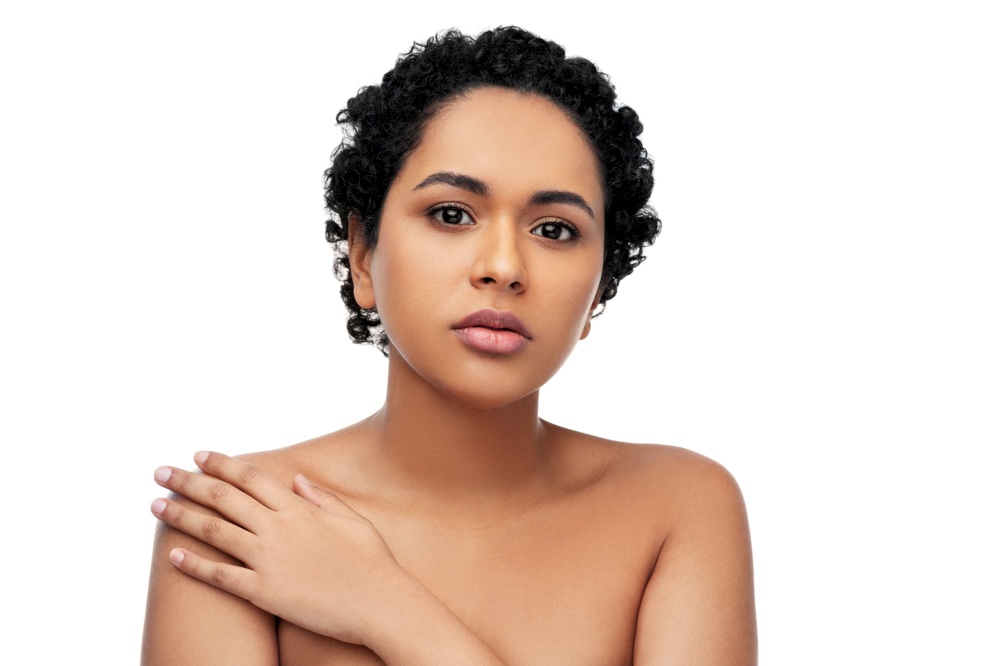 beauty and people concept - portrait of young african american woman with bare shoulders over white background. portrait of young african american woman