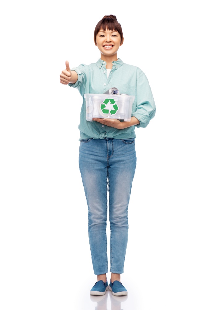 metal recycling, waste sorting and sustainability concept - smiling young asian woman holding plastic box with tin cans over white background. smiling young asian woman sorting metallic waste