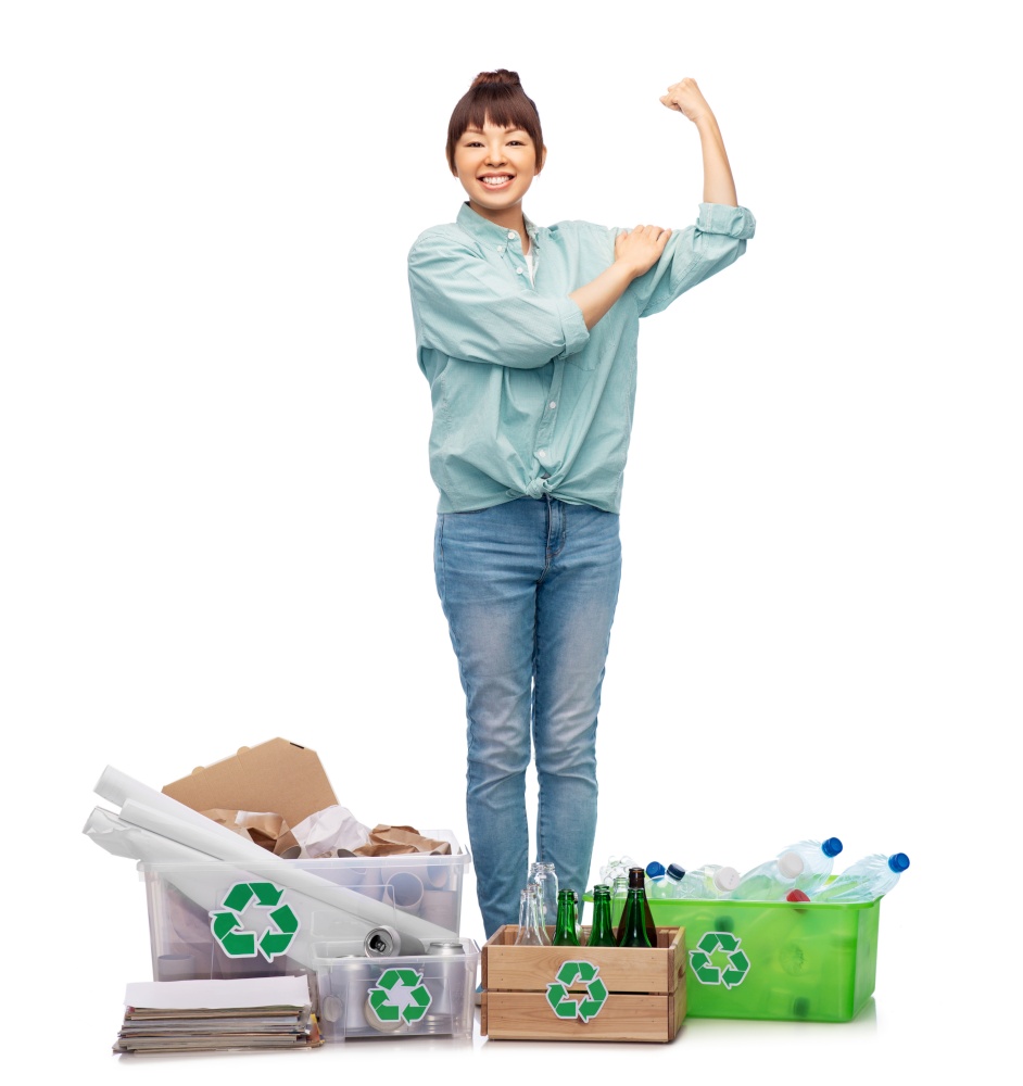 recycling, waste sorting and sustainability concept - smiling young asian woman with plastic and glass bottles, papers and metal tin cans in boxes showing strong arms over white background. happy woman sorting paper, metal and plastic waste
