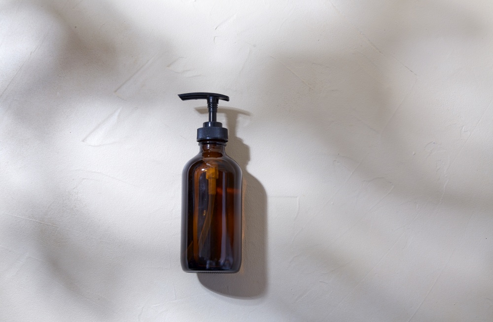 beauty, cosmetics and object concept - bottle of shower gel or liquid soap with dispenser. bottle of shower gel or liquid soap with dispenser