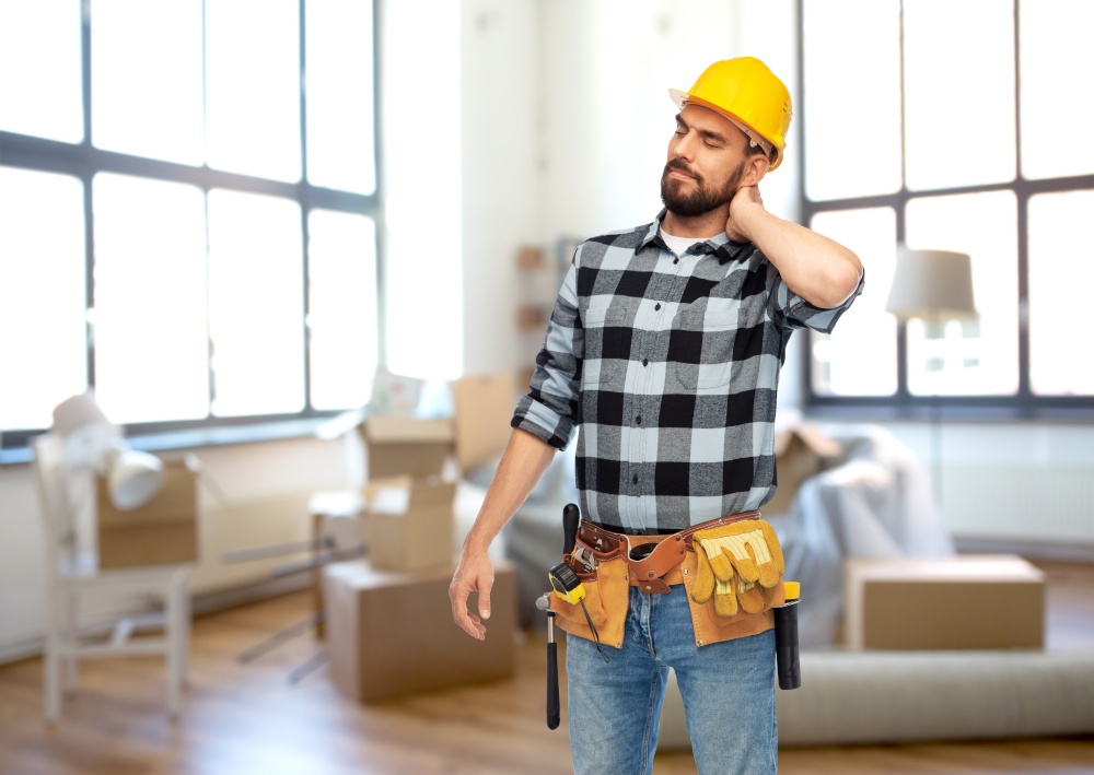 repair, construction and building concept - male worker or builder in helmet with neck pain over home room background. male worker or builder with neck pain at home
