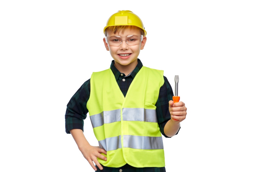 building, construction and profession concept - happy smiling happy smiling little boy in protective helmet and safety vest holding screwdriver over white background. happy boy in building helmet with screwdriver