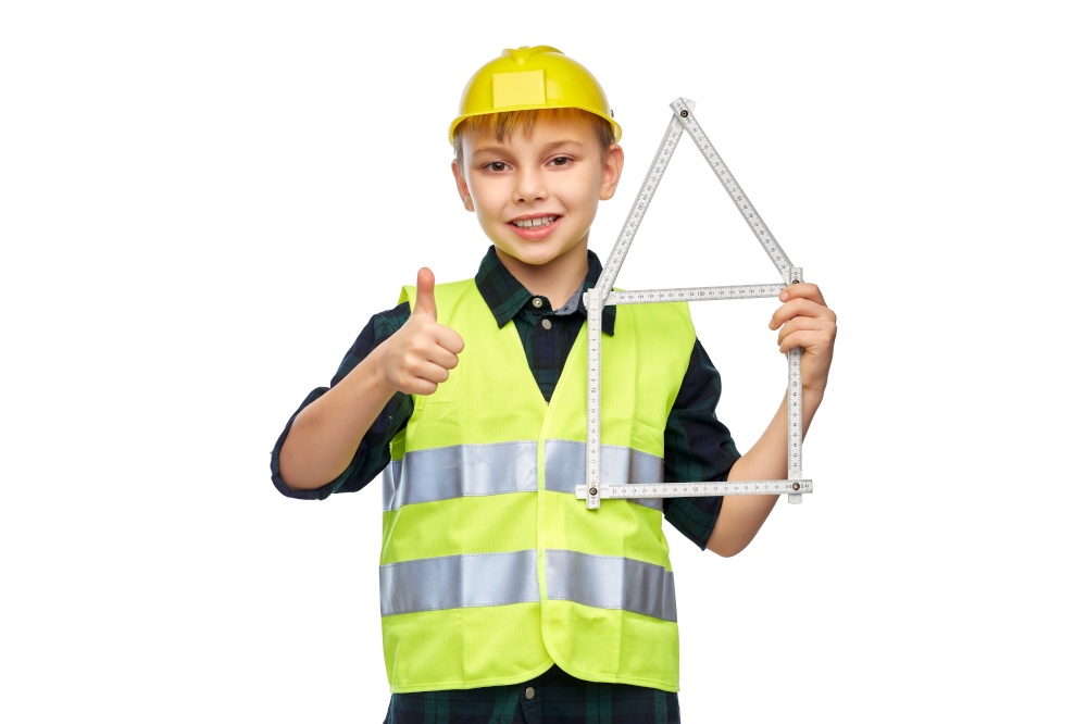 building, construction and profession concept - happy smiling little boy in protective helmet and safety vest with ruler in shape of house showing thumbs up gesture over white background. boy in helmet with ruler in shape of house
