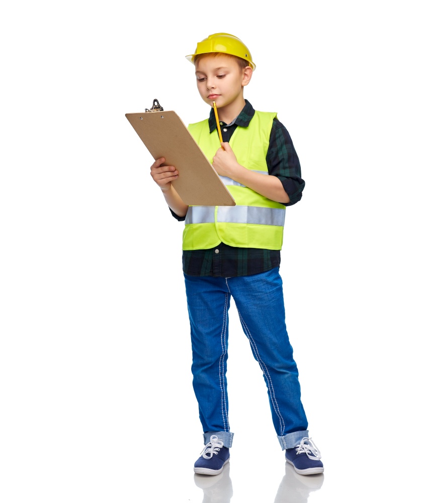 building, construction and profession concept - happy smiling little boy in protective helmet and safety vest with clipboard and pencil over white background. little boy in helmet with clipboard and pencil