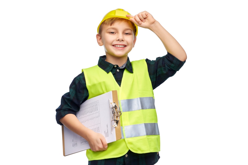 building, construction and profession concept - happy smiling little boy in protective helmet and safety vest with clipboard over white background. little boy in construction helmet with clipboard