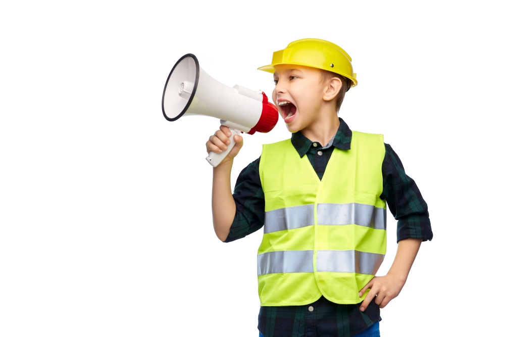 building, construction and profession concept - happy smiling little boy in protective helmet and safety vest talking to megaphone over white background. boy in protective helmet talking to megaphone
