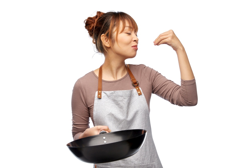cooking, culinary and people concept - happy smiling female chef in apron with frying pan making gourmet gesture over white background. happy smiling female chef with frying pan