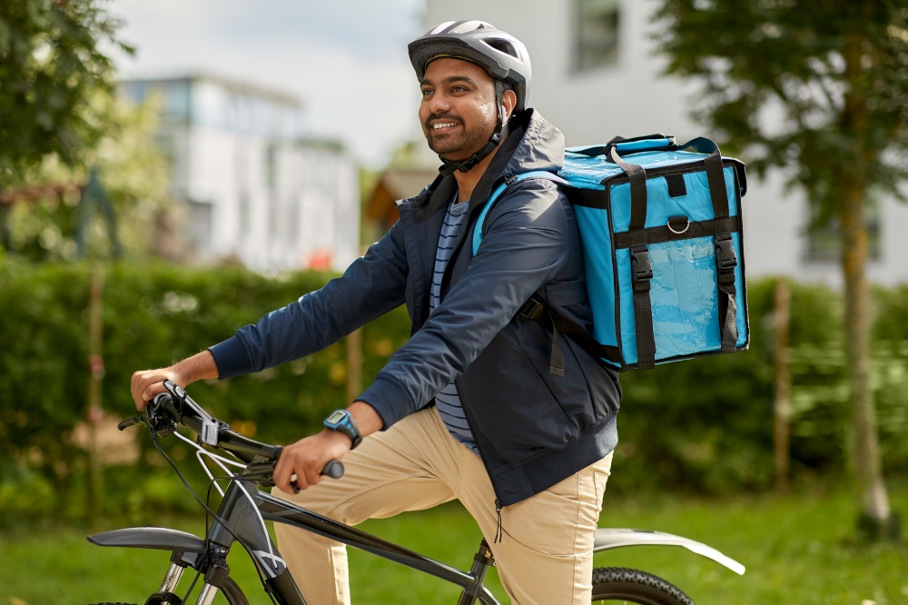 food shipping, profession and people concept - happy smiling delivery man with thermal insulated bag and bicycle on city street. food delivery man with bag and bicycle in city