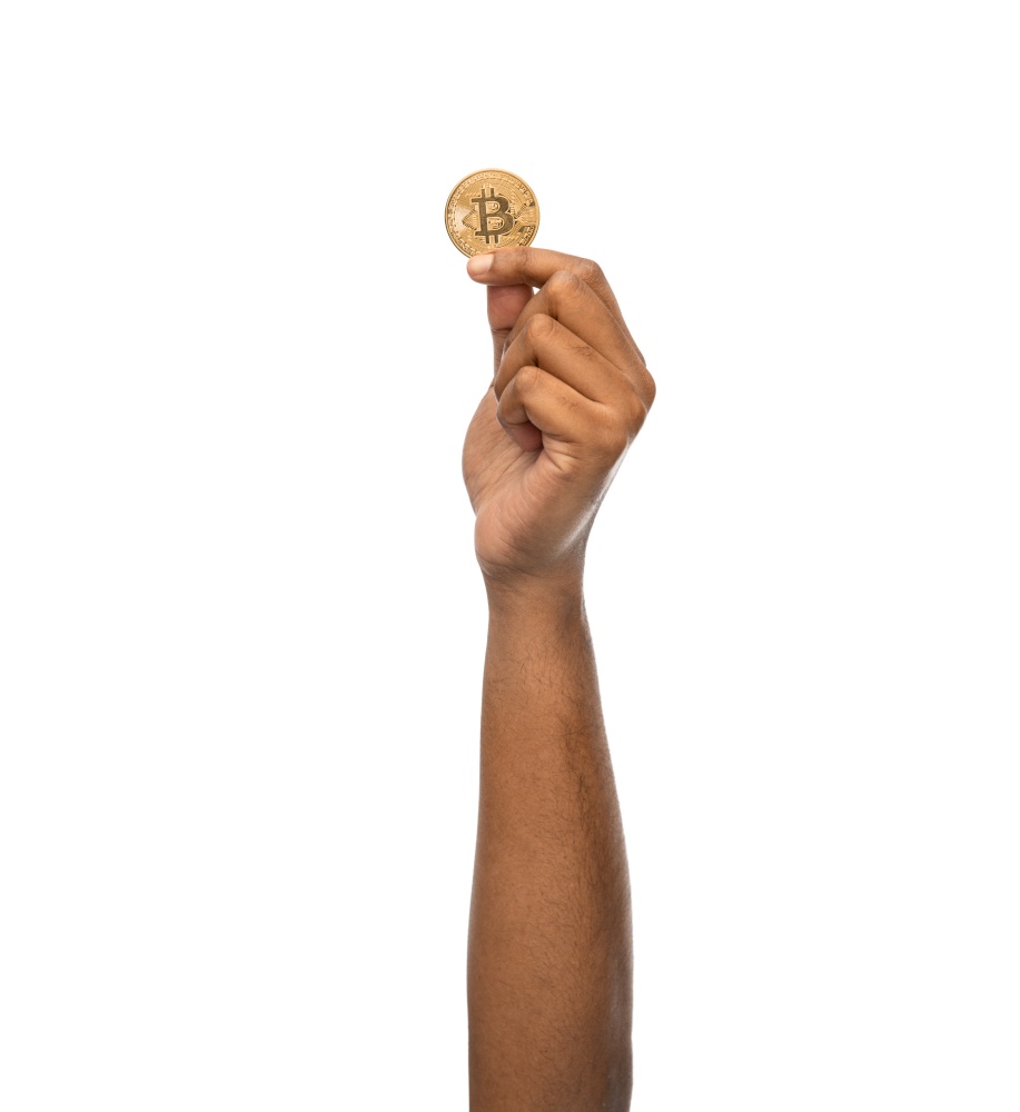 cryptocurrency, finance and business concept - close up of female hand holding golden bitcoin over white background. close up of hand with bitcoin over white