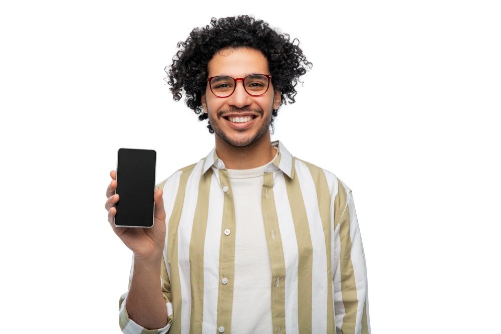 technology and people concept - smiling man in glasses showing smartphone with blank screen over white background. smiling man in glasses showing smartphone