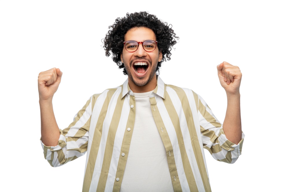 success, emotion and expression concept - happy man in glasses celebrating victory over white background. happy man in glasses celebrating victory