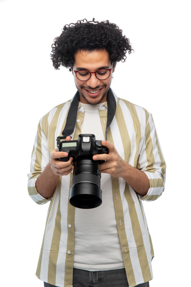 photography, profession and people and concept - happy smiling man or photographer in glasses with digital camera over white background. smiling man or photographer with digital camera