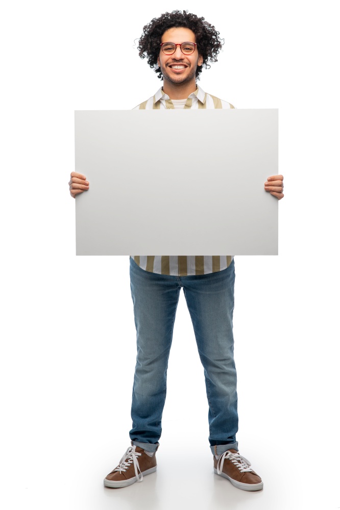 people concept - happy smiling young man in glasses holding big board over white background. smiling man in glasses holding big white board