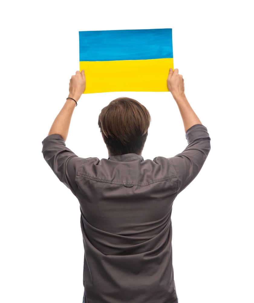 independence day, patriotic and human rights concept - man holding flag of ukraine on demonstration over white background. man holding flag of ukraine