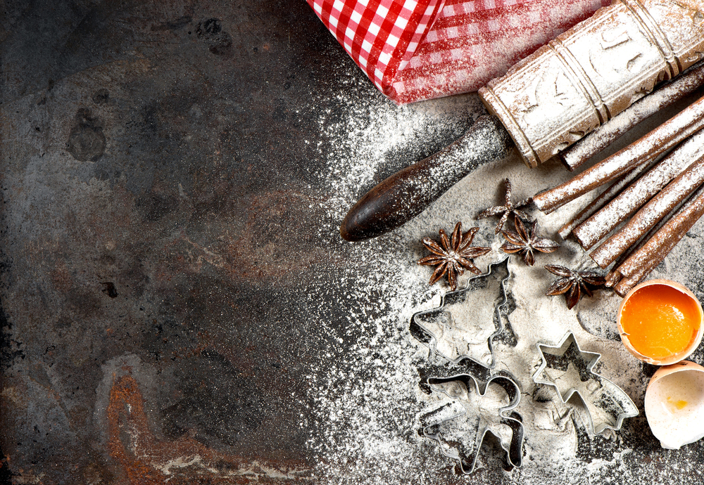 Christmas food. Baking ingredients, spices and tools. Flour, eggs and cookie cutters