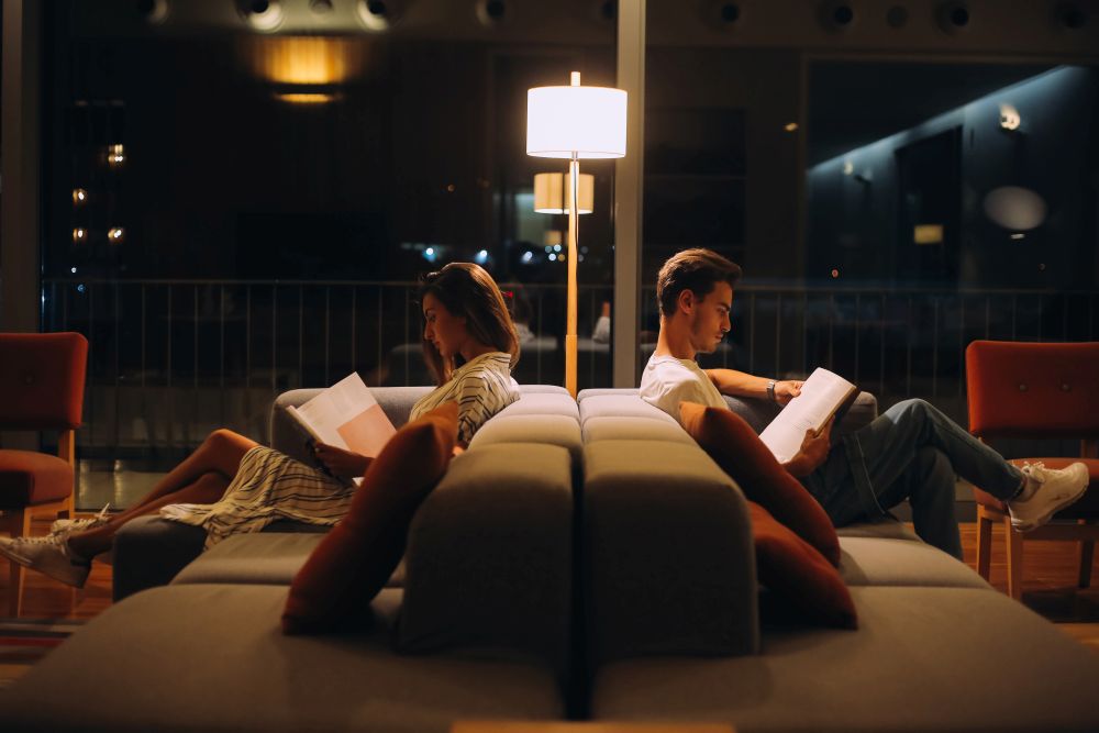 Man and woman reading books - Natural night light