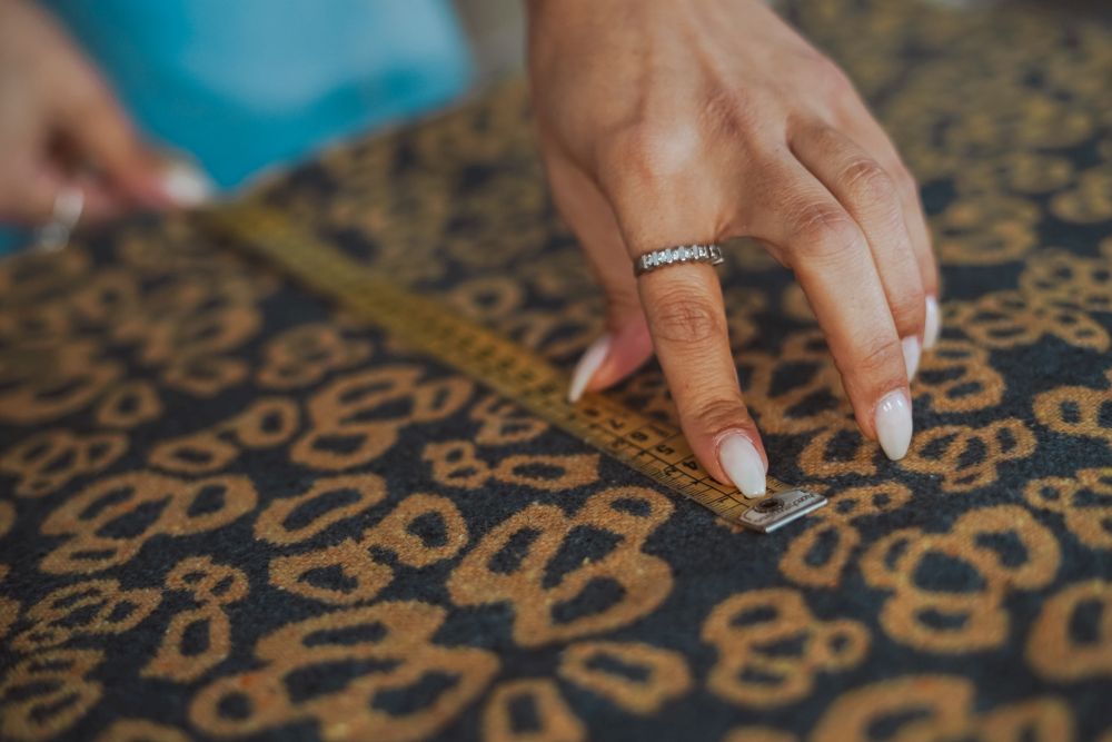 Tailor woman hands working on fabric - Tailoring