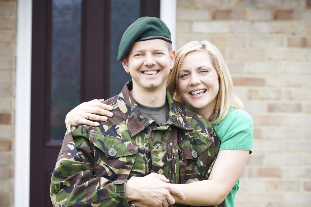 Portrait Of Soldier With Wife Home On Leave From Army