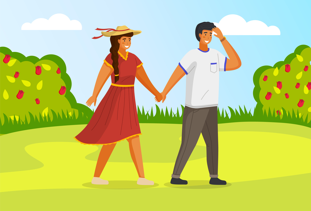 Young guy and girl holding hands walking in summer garden, weekend walk in park. Friends man and woman met on a date outdoor. Trip out of town, active lifestyle. Couple walking in a countryside. Young guy and girl holding hands walking in summer garden, weekend walk in park sunny day