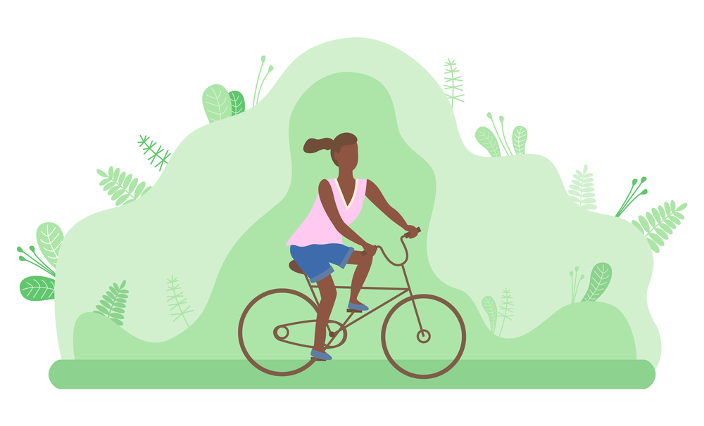 Young dark girl rides bicycle in green area. Recreation and sports. Activity on fresh vacation. Cycling, health care. Active lifestyle. Learn to ride a bike. Lush foliage of trees, forest background. Young girl rides a bicycle in a forest or park area. Outdoor activity. Spotr and recreation