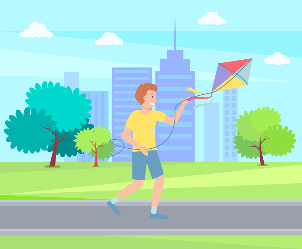 Playing boy with kite running in urban park at city buildings background, outdoors leisure or activity, summertime, childhood, little happy child teenager play with kite, playtime, cartoon character. Playing boy with kite running in urban park at city buildings background, outdoors leisure activity