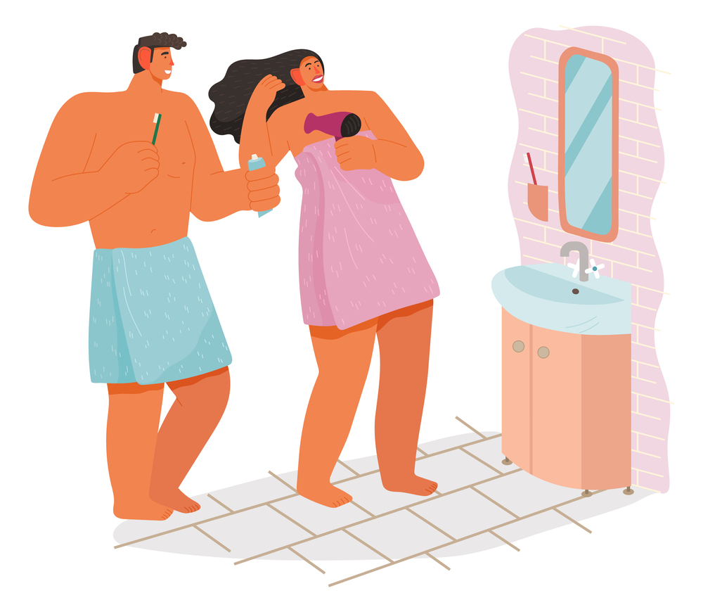 Morning time, young couple in bathroom making hygiene, man cleaning teeth, holding toothpaste and toothbrush, woman drying her hair with hair dryer, people standing in front of sink, looking at mirror. Morning time, young couple in bathroom, man cleaning teeth, woman drying hair with hair dryer